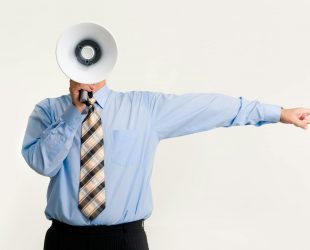 man with megaphone pointing